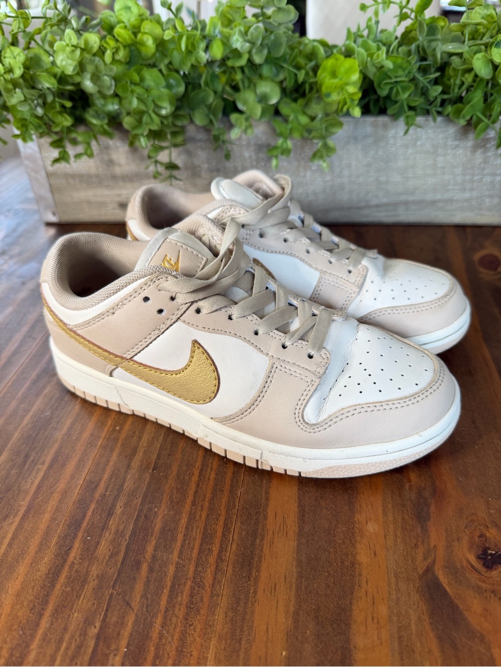 Nike Women's Low-Top Sneakers in White and Gold Accent